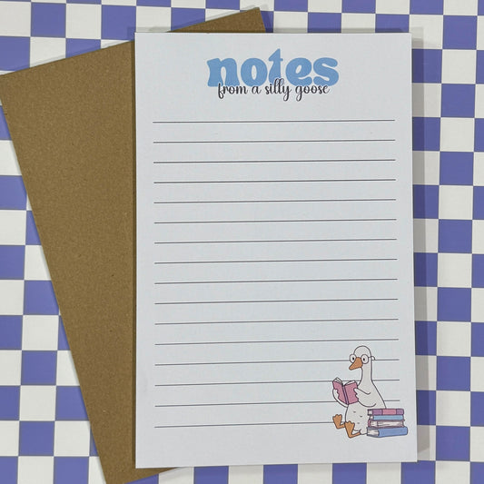Notebook with 'notes from a silly goose' text and a cartoon goose on a checkered background